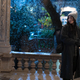 Kate Bishop standing in the snow on a porch.